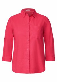 Chemise rose à boutons avec col, manches longues retroussées aux poignets et poche poitrine. Fabriquée en tissu léger avec une texture lisse.