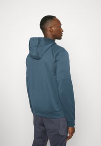 Nike Performance Majica s kapuljačom - deep jungle/luminous green/black