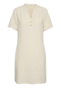 Linnedress i ljusbeige, med korta ärmar, en V-ringning med knäppning fram och en avslappnad passform. Synlig detaljerad struktur på tyget.