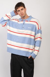 Light blue, striped, plush pullover with red and cream horizontal stripes; features a collar and three-button placket; loose fit.