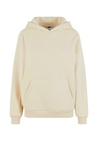 Sweat à capuche couleur crème en tissu doux, avec une poche avant, une capuche à cordon de serrage, et des poignets et un ourlet côtelés.