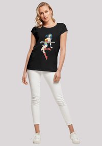 Black t-shirt featuring a graphic of Wonder Woman in bright colors. Designed with a round neckline and short sleeves.