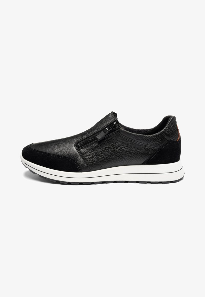 Black leather slip-on sneaker with side zipper, textured upper, suede accents on toe and heel, and white rubber sole.