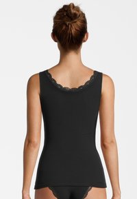 Black ribbed tank top with a smooth texture and lace trim at the neckline. Fitted design, sleeveless, and hip-length.