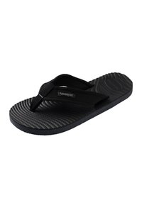 Tongs Havaianas noires avec semelle texturée et brides en tissu, affichant le nom de la marque sur la bride latérale.