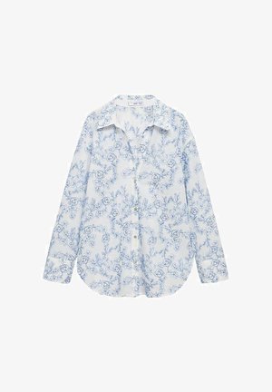 Bílá košile na knoflíky s modrým květinovým potiskem, dlouhými rukávy a klasickým límečkem. Plynulá tkanina se mírně zakřiveným spodním lemem.