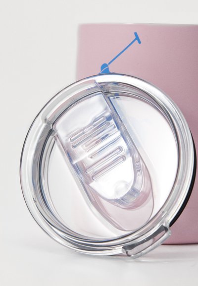 Clear plastic lid with a curved shape and a central opening, featuring ridged accents, positioned above a pink container.