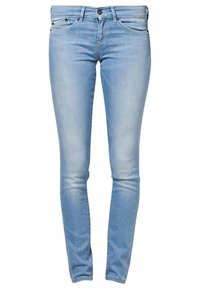 Light blue skinny jeans made of denim; features five pockets, a zip fly, and slight fading for a worn look.