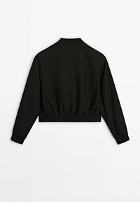 Veste courte noire à manches longues avec col côtelé, poignets et taille élastique, vue de dos sur fond blanc.