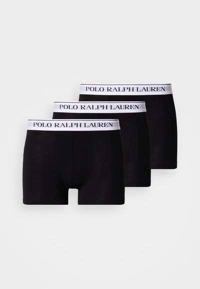 Cuecas boxer para homem pretas, em pack de três, com cós branco com "POLO RALPH LAUREN" impresso a preto. Material macio em algodão.