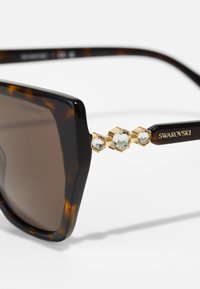 Swarovski Solbriller - dark havana/dark brown