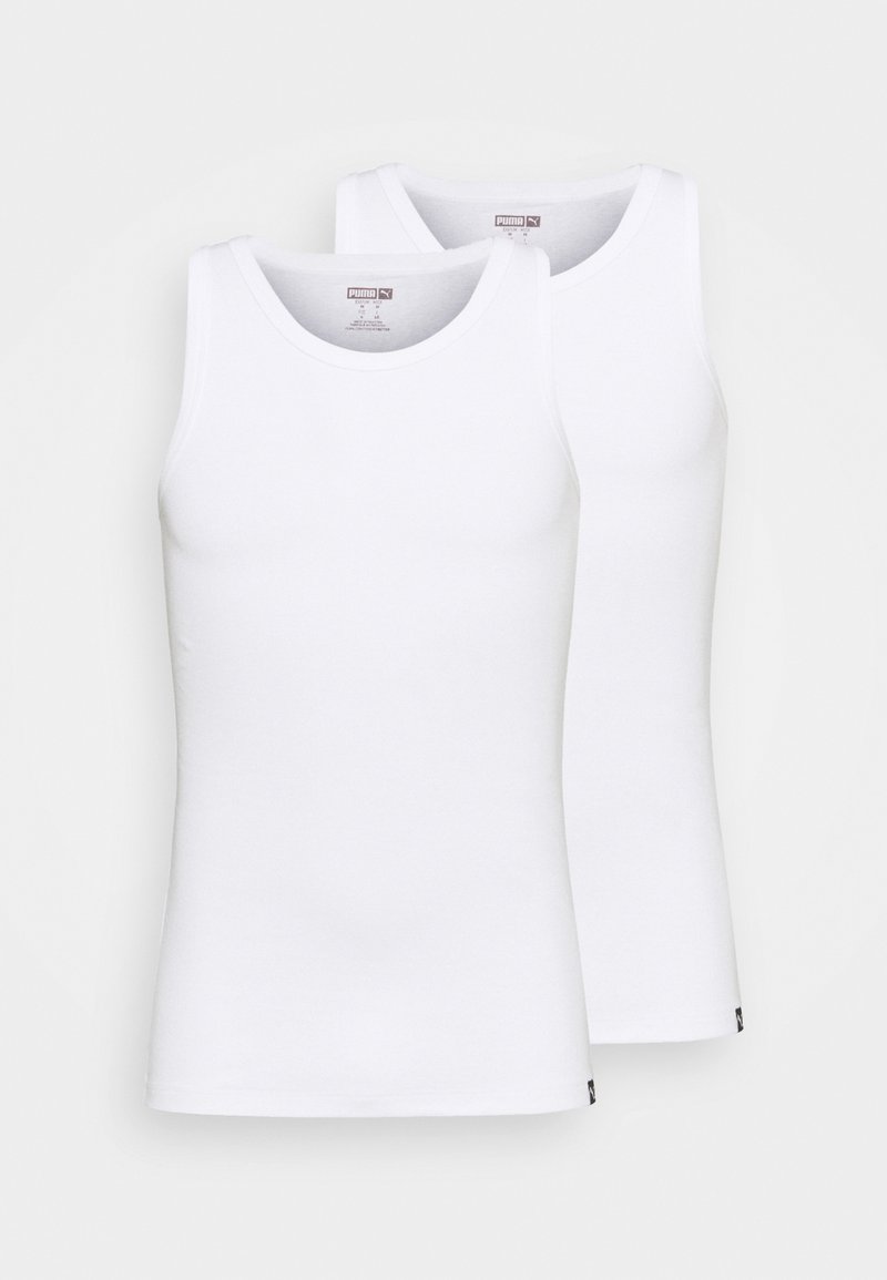 Two white tank tops made of cotton, featuring crew necks and no sleeves. Each top has a small logo at the hem. Smooth texture.