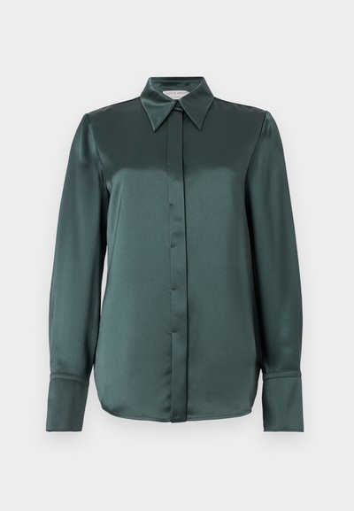 Dark teal long-sleeve satin blouse with pointed collar, hidden front button placket, and extended wide cuffs.