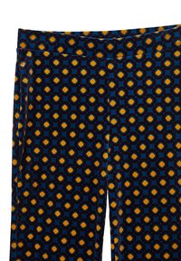 Eng anliegende Leggings mit einem tiefblauen Hintergrund, verziert mit einem kräftigen Sechseckmuster in Orange und Gelb, aus weichem, strukturiertem Stoff hergestellt.