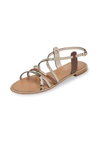 Strappy flat sandals featuring a mix of metallic and animal print textures, tan sole, and an adjustable ankle strap with a minimalist design.