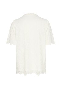 White lace short-sleeve top with scalloped hem, featuring intricate floral patterns and textured surface for a delicate appearance.