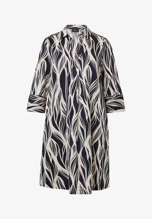 Abito camicia blu navy e panna con un motivo a foglia botanica. Caratterizzato da un colletto, una fila di bottoni e maniche a tre quarti. Tessuto leggero.