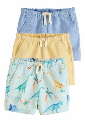 Three children's shorts stacked, featuring blue linen, yellow cotton, and light blue with colorful dinosaur and palm tree prints.