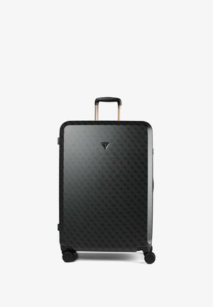 Valise rigide noire avec un motif de logo subtil, poignée télescopique, quatre roues et un petit emblème triangulaire de la marque à l'avant.