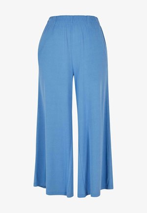 Lysblå bredde bukser lavet af blødt stof, med en elastisk talje og en løs pasform, der strækker sig til midt på læggen.
