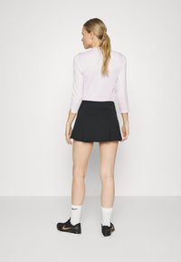 Nike Performance FLOUNCY - Falda de deporte - black/white