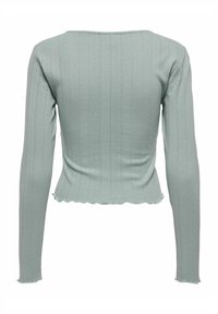 Langarm, ribbel trui in licht muntgroen. Getailleerd ontwerp met een scalloped zoom en een brede ronde halslijn. Soepele textuur.