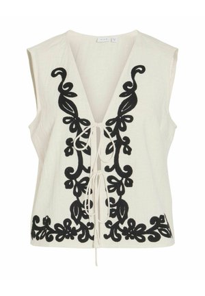 Hvitt ermeløst vester med dyp V-hals og svart blomsterbroderi langs forkantene, bundet med to hvite snorbånd.