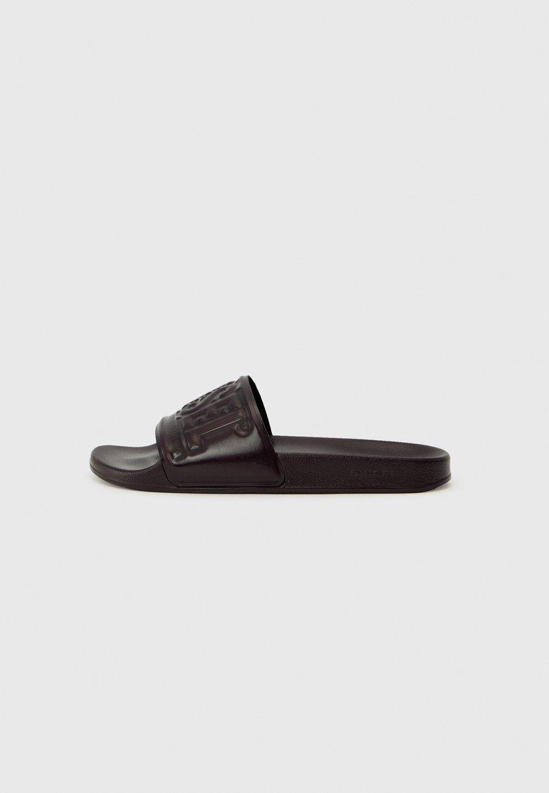 Black slide sandal featuring a textured upper with embossed design, flat sole, and smooth finish. Made from synthetic materials.