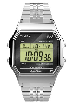 Digital watch with a silver stainless steel band, octagonal silver case, black face, green digital display, and INDIGLO backlight feature.