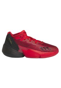 Zapatilla deportiva roja con parte superior de punto texturizado, acentos en negro y un talón estructurado. Presenta tres franjas en el costado y cordones llamativos.
