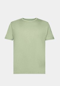 T-shirt vert clair en tissu doux, avec un col rond et des manches courtes, arborant un motif subtil et texturé sur toute la surface.