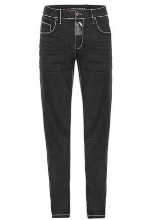 Schwarze Jeanshose aus Denim mit weißen Nähten, slim fit, fünf Taschen-Design und einem Knopfverschluss vorne. Mit einem Etikett am Bund.