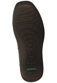 Black rubber shoe sole with a textured pattern of wavy lines, featuring a rectangular green label with "Josef Seibel" embossed.