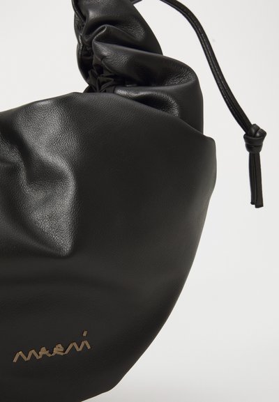 Black leather bag with a gathered design and drawstring closure. Features a subtle logo in metallic gold at the bottom. Smooth texture.
