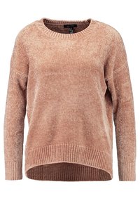 Stofzuigroze oversized sweater met een ronde hals, geribbelde zoom en textuurstof. Lange mouwen en een licht gebogen onderrand.