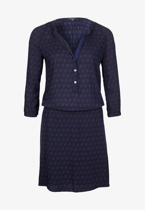 Marineblaues Kleid mit langen Ärmeln, durchgehender Knopfleiste, mit einem kreisförmigen Muster und einem lockeren Schnitt. Weicher Stoff mit einer glatten Textur.
