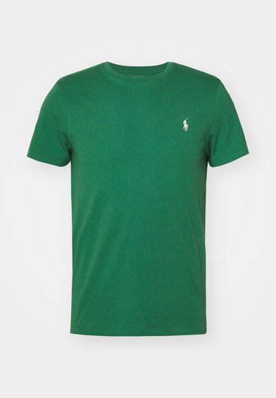 Πράσινο βαμβακερό μπλουζάκι με γύρο λαιμό, κοντά μανίκια και μικρό λευκό λογότυπο αλόγου στο αριστερό στήθος. Λείο υλικό, κανονική εφαρμογή.