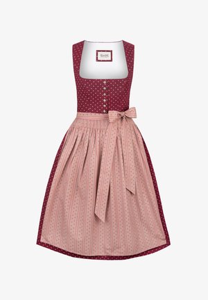 Traditionelle bayerische Tracht mit einem bordeauxfarbigen Polka-Dot-Oberteil, einer weißen Bluse und einem gefältelten rosa Rock mit feinen vertikalen Streifen und einer Schleife.