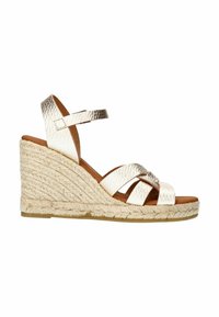 Wedge sandals featuring a metallic gold leather upper, multiple crisscross straps, and a jute-wrapped platform with a textured finish.