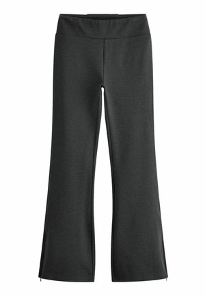 Zúžené černé kalhoty vyrobené z jemného, elastického materiálu s širokým pasem. Švy podél boků zdůrazňují zúžený design.