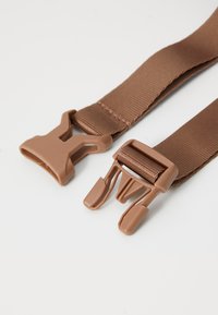 Brown nylon strap with plastic clips. Includes a flat buckle and a hook-style fastener, featuring a smooth texture.