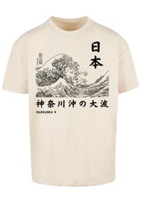 Cream cotton T-shirt featuring a black wave graphic, Japanese text, and stylized branding at the bottom. Classic crew neck design.
