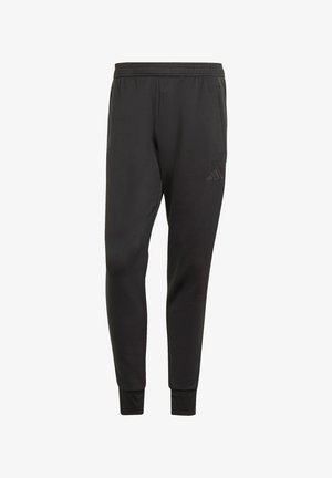 Black polyester joggers featuring an elastic waistband, tapered legs, and a subtle embossed logo on the left thigh. Breathable fabric.