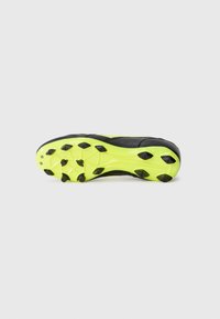 Black soccer cleat with a bright yellow outsole, featuring multiple black studs. Smooth texture with a streamlined design.