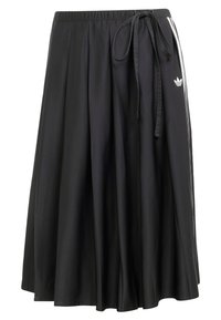 Black midi skirt with elastic waistband, side tie, white stripes, and Adidas trefoil logo on the right side.