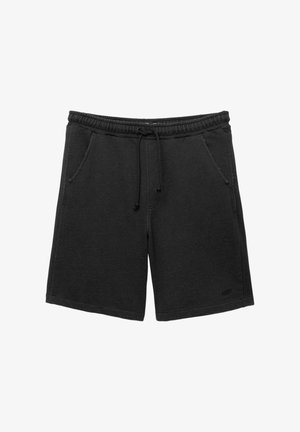 Shorts in cotone nero con un elastico in vita, cordoncino regolabile, due tasche laterali e un accento del logo sull'orlo.