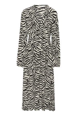 Fekete-fehér zebra mintázatú ruha hosszú ujjakkal, mély V nyakkivágással és ráncolt derékrésszel. Áramló anyagból készült, térd fölé érő fazon.