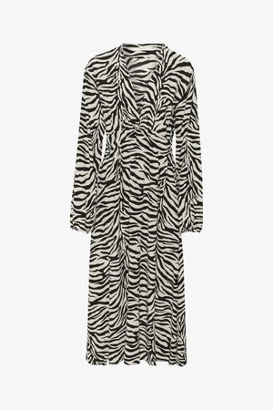Vestido com estampado de zebra em preto e branco, com mangas longas, decote em V profundo e detalhe na cintura franzida. Tecido fluido, design até ao joelho.