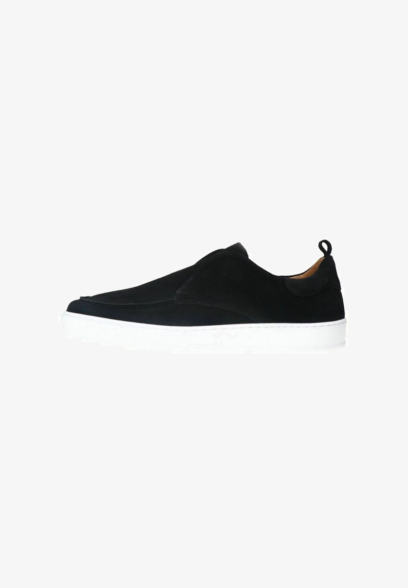 Black suede slip-on shoe with a white rubber sole, featuring a smooth surface and a small rear tab for easy wear.