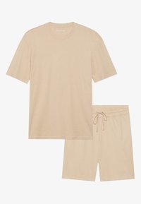 Beige pamut rövid ujjú póló kerek nyakkal és hozzá illő sorttal, ami gumírozott derékkal és zsinórral rendelkezik. Simátextúra.